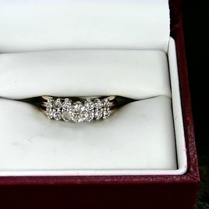  womens diamond ring, 14kt gold, middle diamond surrounded by 12 diamonds
