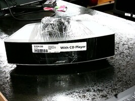 Bose radio has built in CD player. Includes power cord and remote conrol