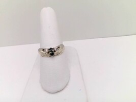 Unqiue 10kt Gold Ring with Hands Holding black and diamond stones.  $179.00